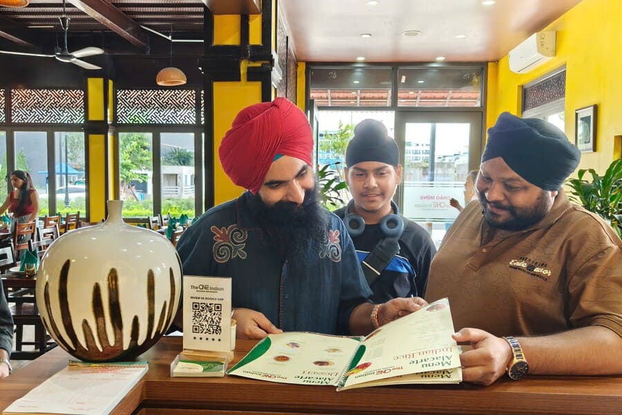 Flying Flyer group dining at The One Indian Halong Restaurant with traditional Indian dishes in Halong City