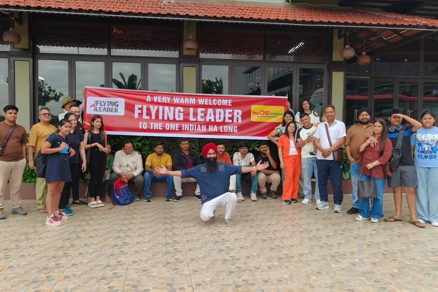 International travelers from Flying Flyer experiencing Indian food and hospitality at The One Indian Halong Restaurant